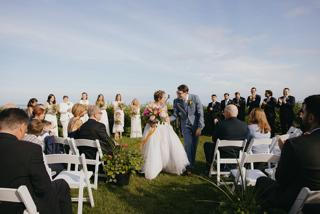 Boston wedding oceanfront bridal party flowers happy outdoor ceremony