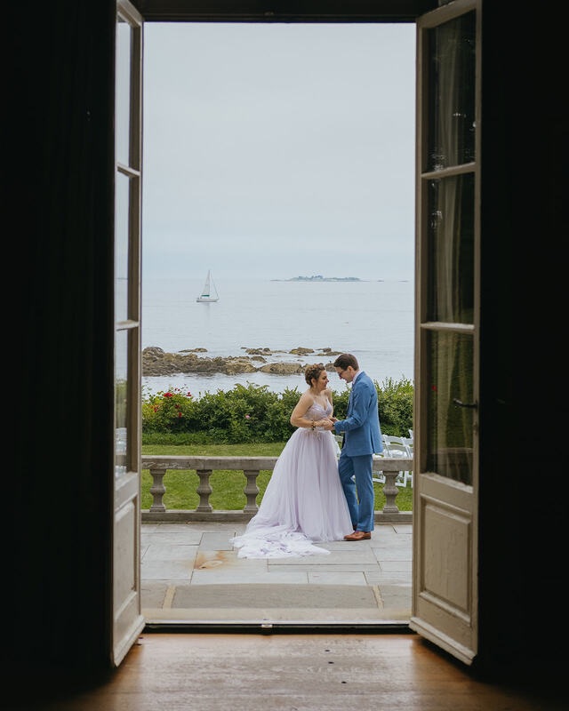 Wedding couple oceanfront balcony doors romantic