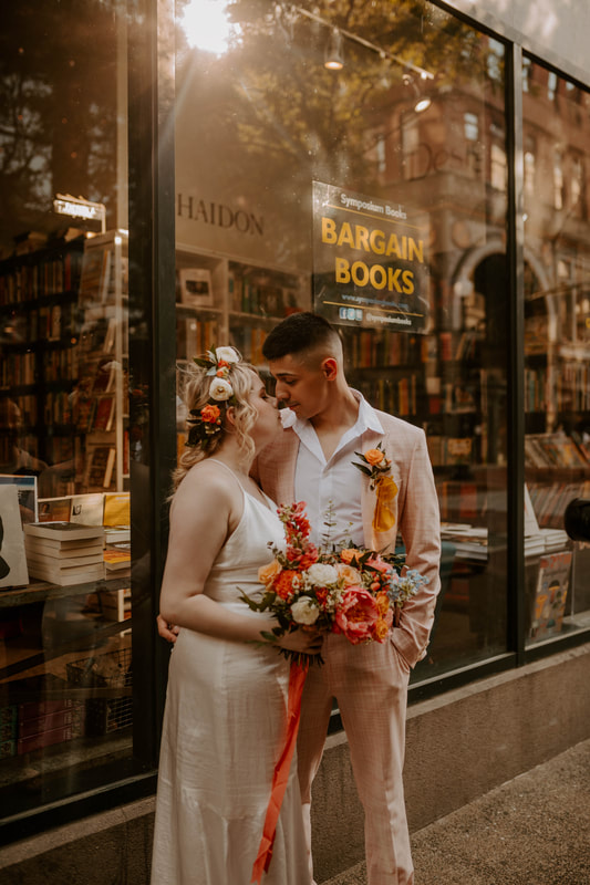 City summer wedding bookstore flowers